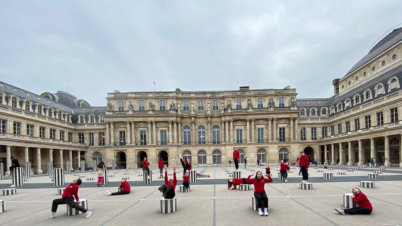 Dancers performing in front of building