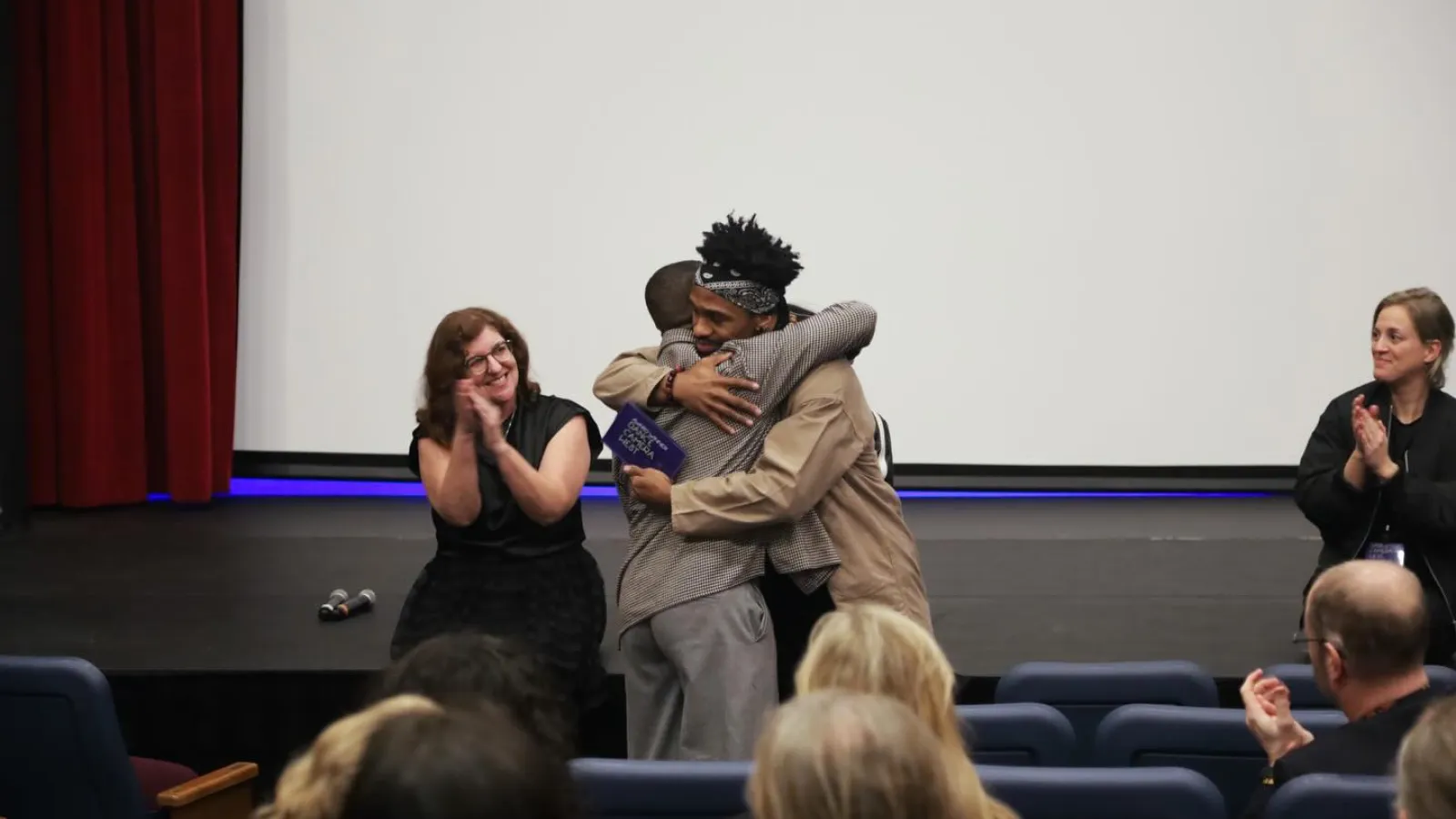 People hugging in celebration 