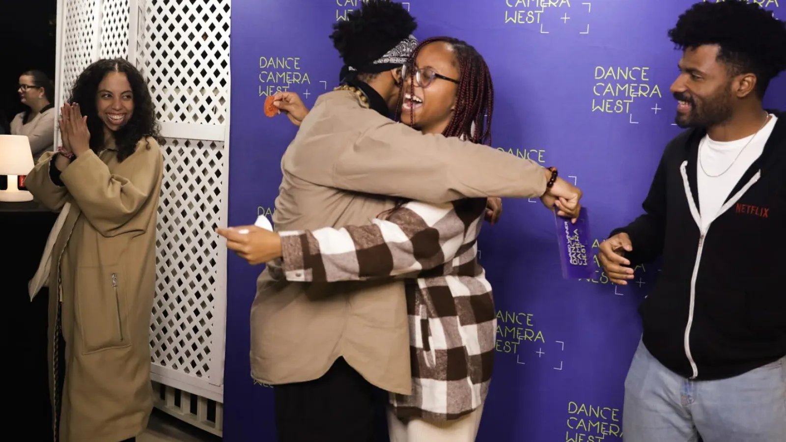 People hugging in celebration 