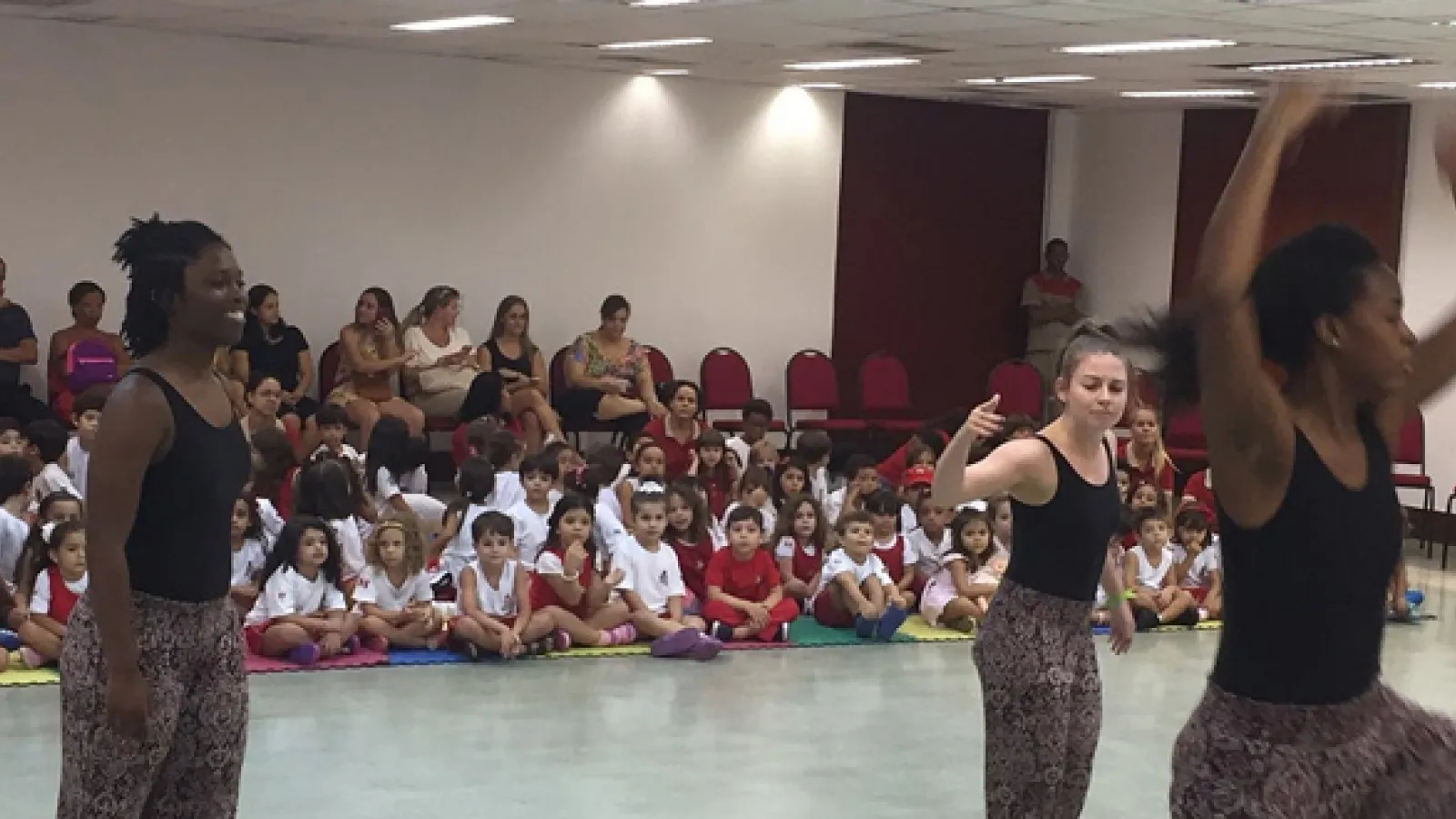 Students perform for children.