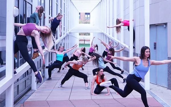 Dancers dancing on structure