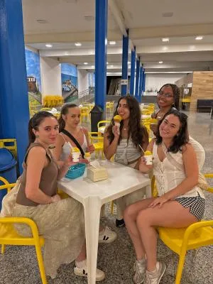 people sitting around a table enjoying ice cream