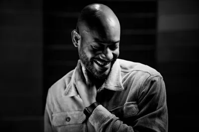 Headshot of bald man wearing dress shirt